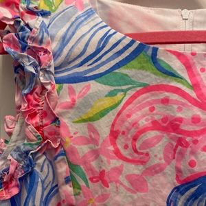Adorable bright printer Lilly dress with ruffle sleeve detail